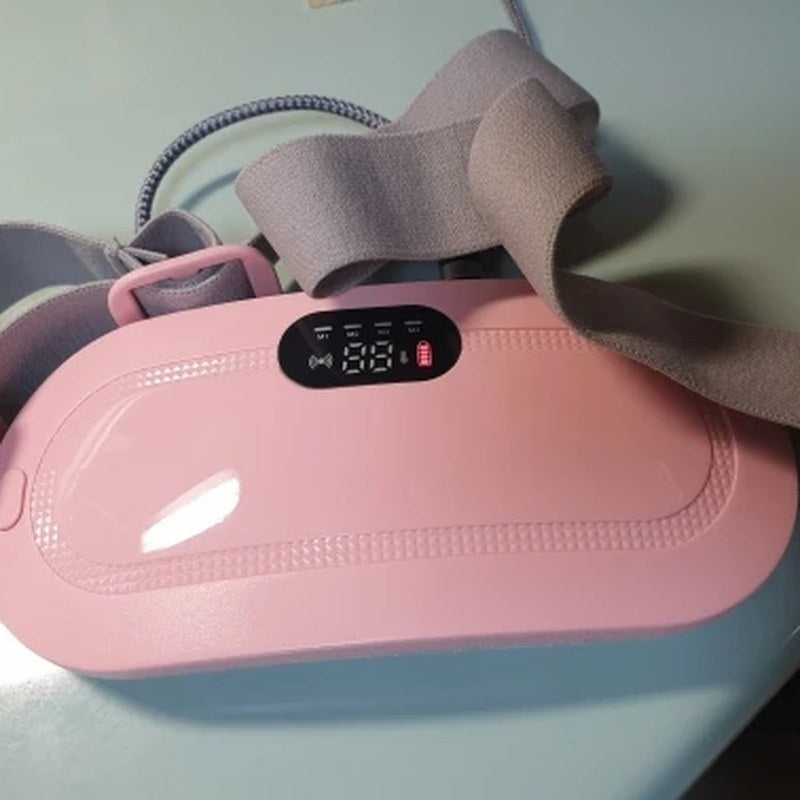 Klantfoto: roze warmteband met display en elastische band op tafel