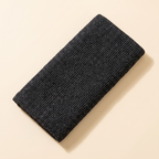 Japanse scrubdoek in zwart met fijn geribd weefsel, opgevouwen