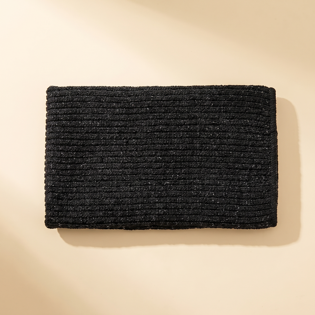Japanse scrubdoek in zwart met grof geribd weefsel, opgevouwen