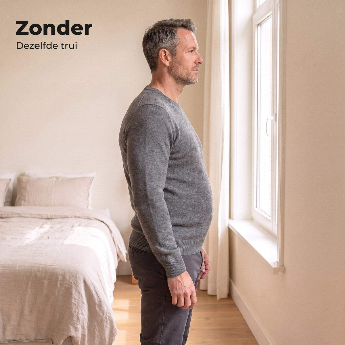 Man in zijaanzicht in een grijze trui zonder shaping shirt, de buik duwt de trui naar voren