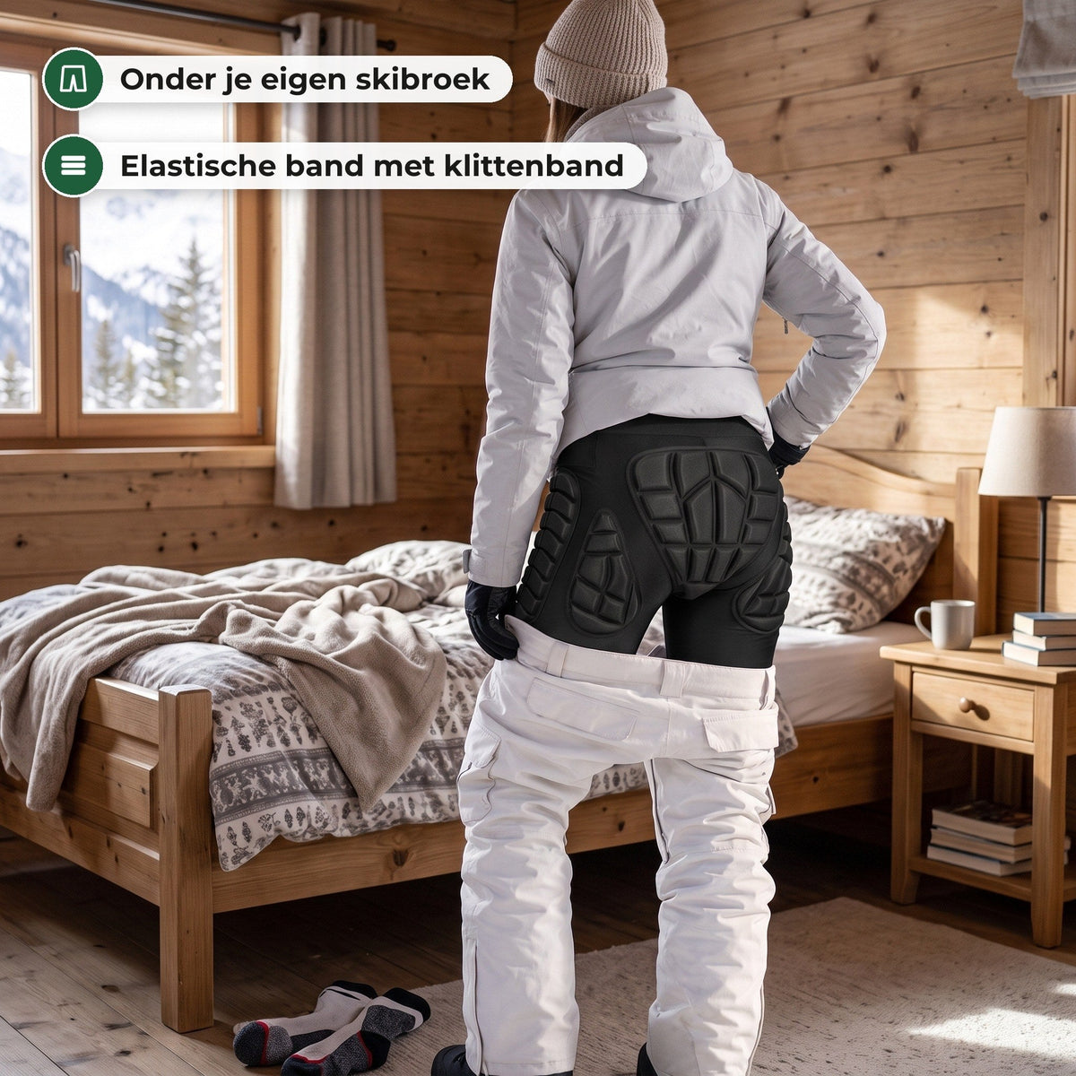 Vrouw in een houten chalet trekt haar witte skibroek op over de zwarte valschort