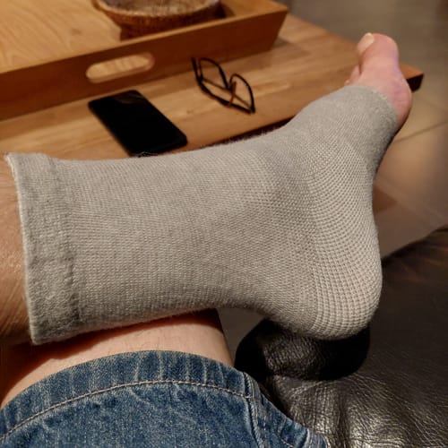 Foto van een klant bij deze voetsleeves