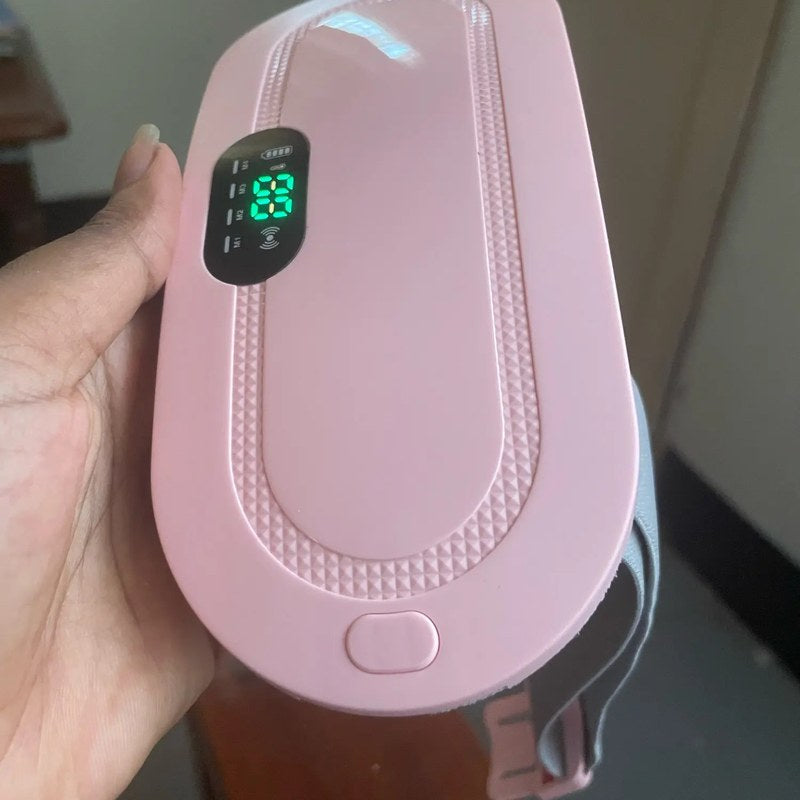 Klantfoto: roze warmteband in de hand met het display aan